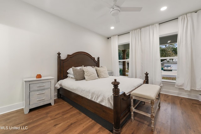 bedroom with ceiling fan and dark hardwood / wood-style floors