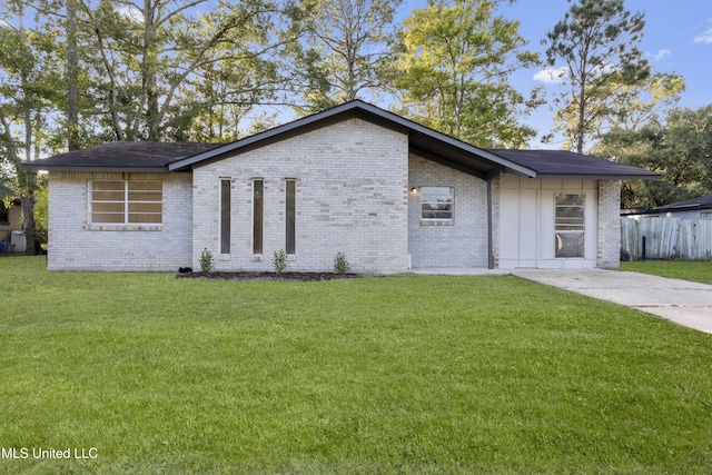 ranch-style house with a front lawn