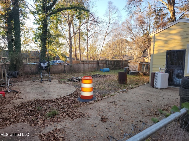 view of yard featuring a patio and central AC