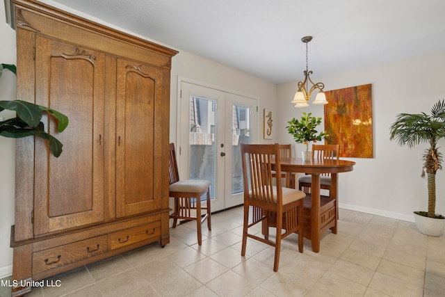 tiled dining area with french doors and a notable chandelier