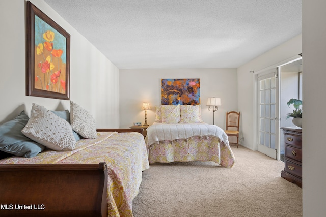 carpeted bedroom with a textured ceiling