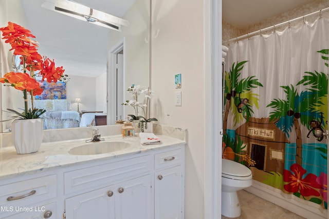 bathroom featuring vanity, tile patterned floors, a skylight, toilet, and curtained shower