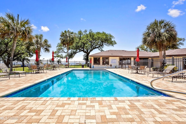 view of pool featuring a patio area