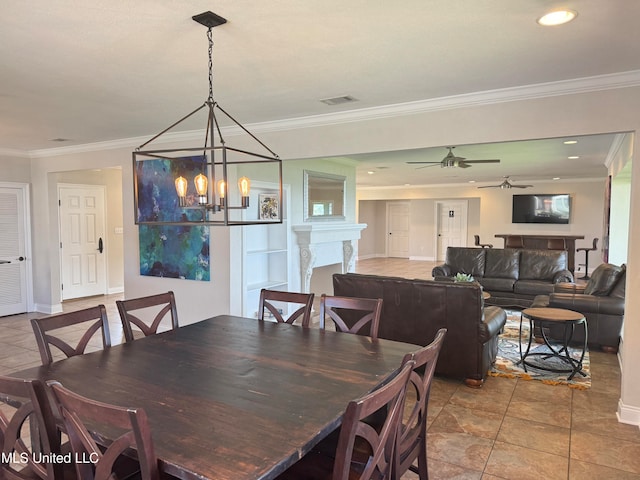 tiled dining area featuring ceiling fan with notable chandelier and ornamental molding