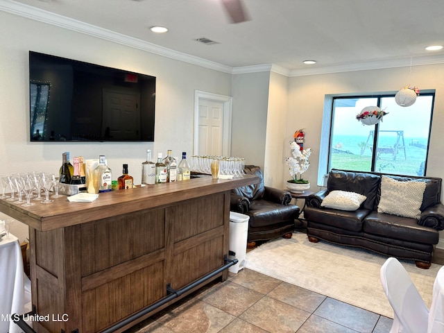 tiled living room featuring bar and crown molding