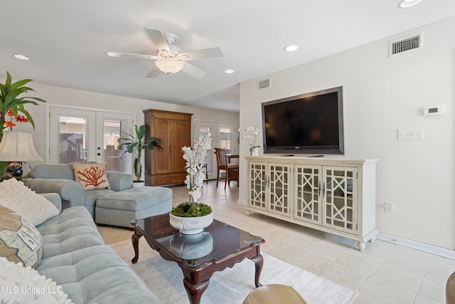 tiled living room featuring ceiling fan, french doors, and plenty of natural light