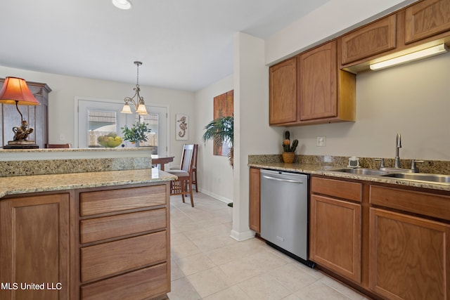 kitchen featuring light tile patterned floors, decorative light fixtures, stainless steel dishwasher, and sink