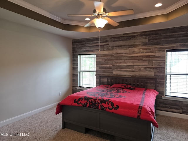 45 Carlsbad, Hattiesburg, MS 39402 - carpeted bedroom featuring wood walls, ornamental molding, an accent wall, baseboards, and a ceiling fan
