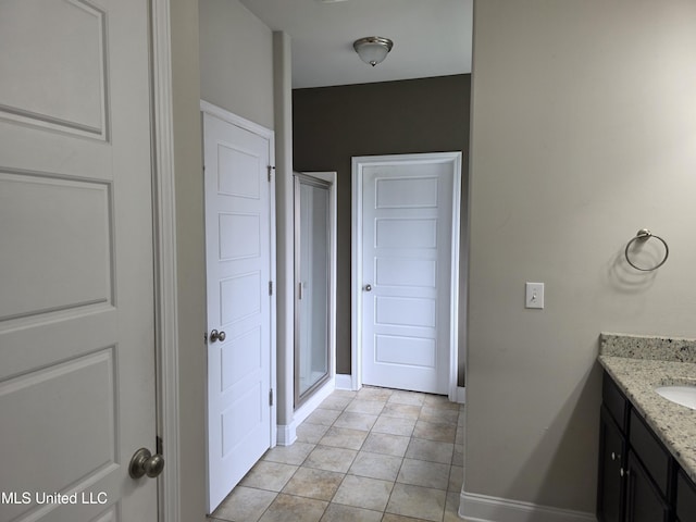 45 Carlsbad, Hattiesburg, MS 39402 - bathroom with vanity, baseboards, and a stall shower