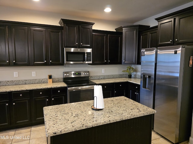 45 Carlsbad, Hattiesburg, MS 39402 - kitchen with dark cabinetry, stainless steel appliances, recessed lighting, and light tile patterned floors
