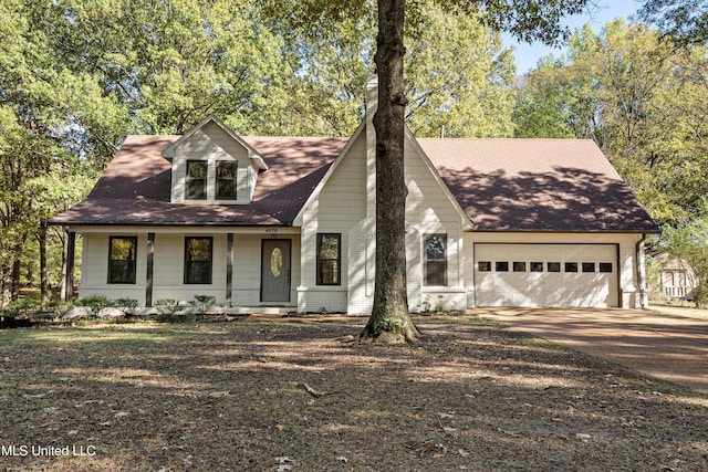 view of front of home featuring covered porch and a garage