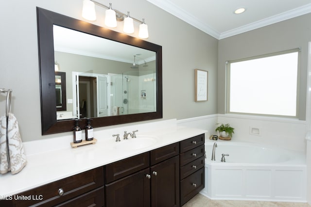 bathroom with vanity, ornamental molding, and separate shower and tub