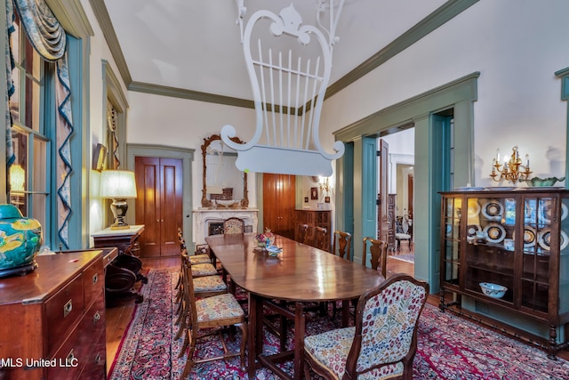 dining area featuring crown molding and hardwood / wood-style floors