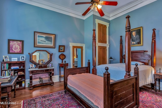 bedroom featuring hardwood / wood-style flooring, ceiling fan, and crown molding