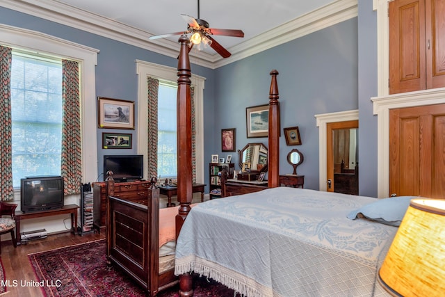 bedroom featuring ceiling fan, crown molding, and dark wood-type flooring