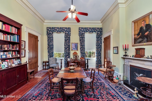 dining area with hardwood / wood-style flooring, ceiling fan, built in features, and crown molding