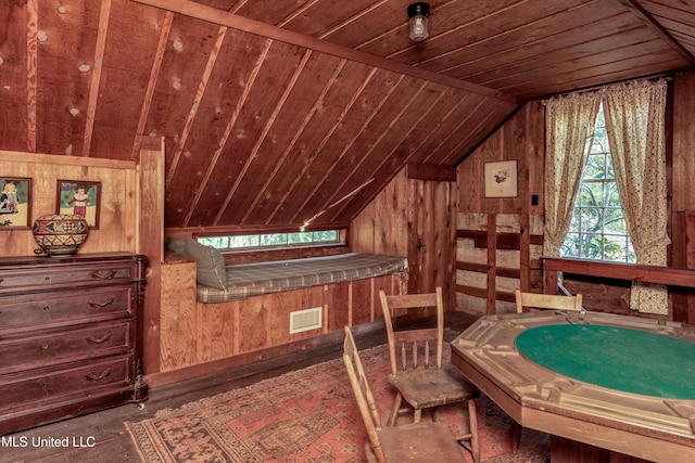 interior space featuring wooden walls, wooden ceiling, vaulted ceiling, and hardwood / wood-style flooring