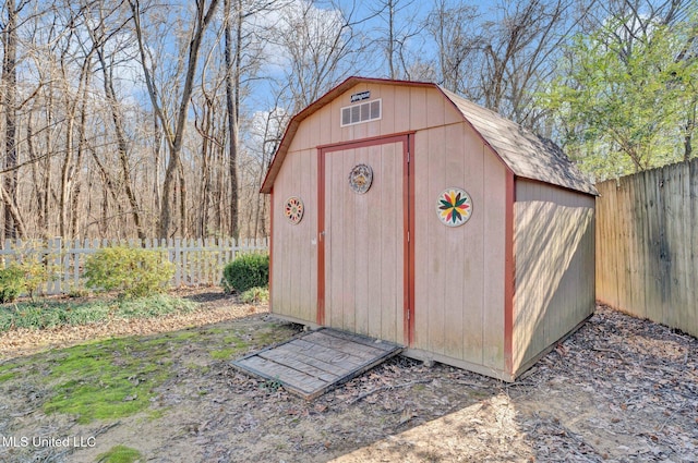 view of shed featuring a fenced backyard