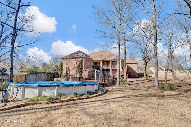 view of pool featuring fence, a fenced in pool, and a yard