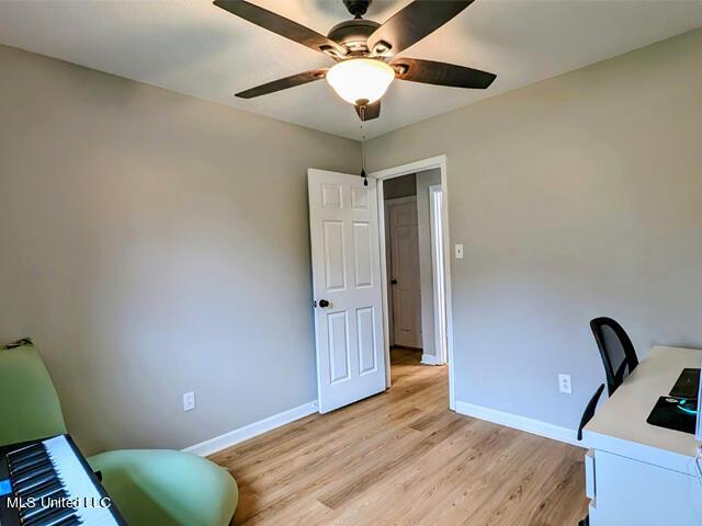 office area with ceiling fan and light hardwood / wood-style flooring