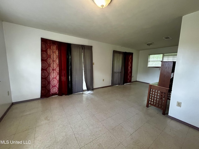 588 Church St, Fayette, MS 39069 - interior space with tile patterned floors, visible vents, and baseboards