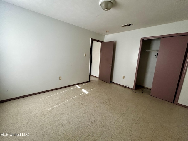 588 Church St, Fayette, MS 39069 - unfurnished bedroom featuring light floors, a closet, baseboards, and visible vents