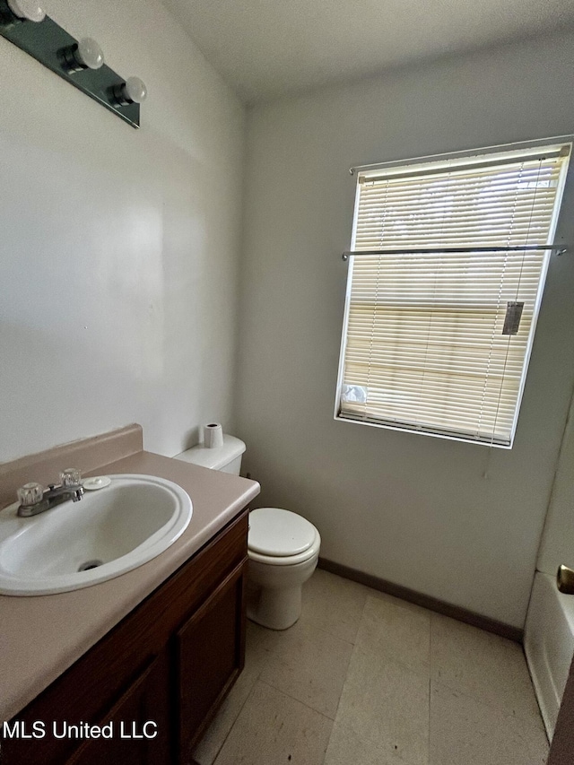 588 Church St, Fayette, MS 39069 - bathroom with vanity, toilet, and baseboards