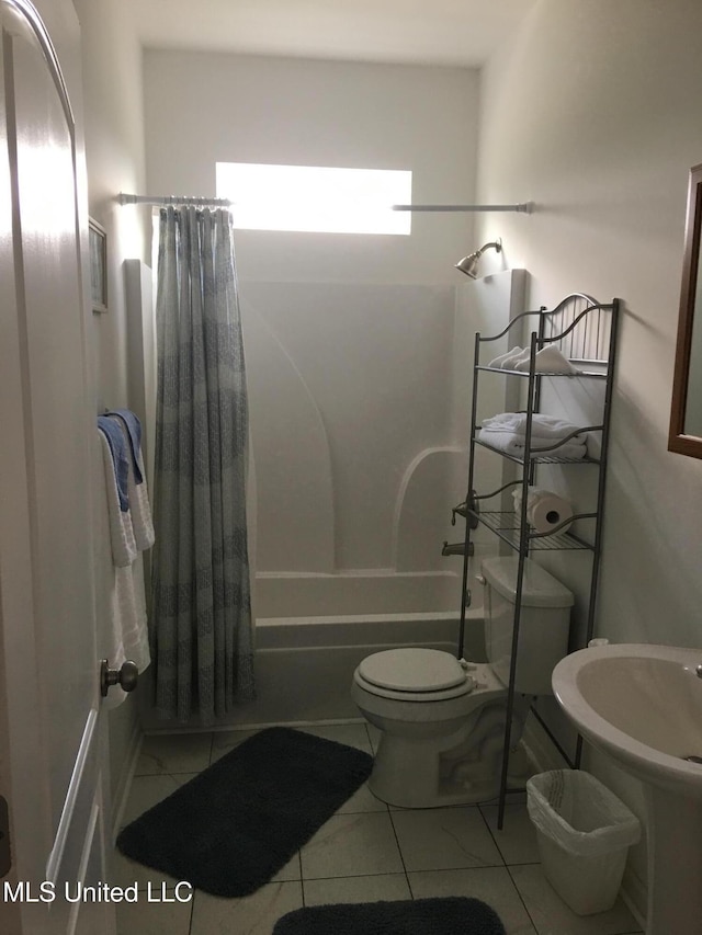 bathroom with toilet, shower / bath combination with curtain, and tile patterned floors