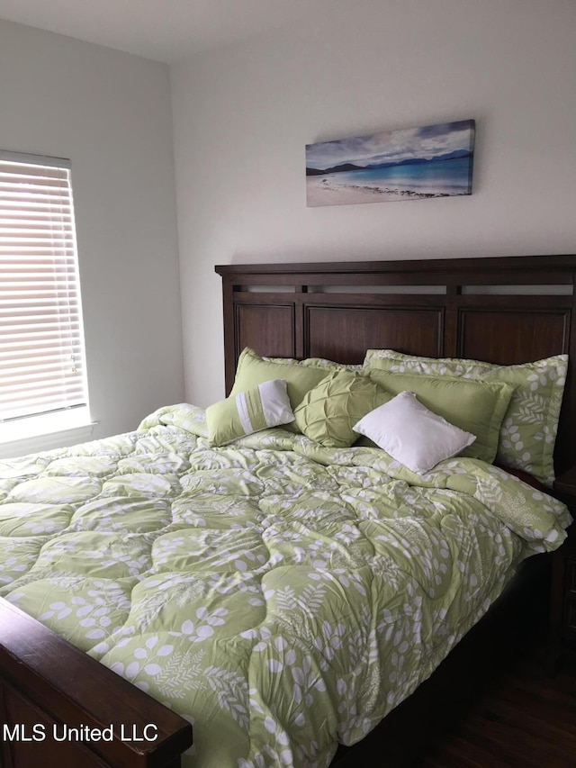 bedroom featuring dark wood-type flooring