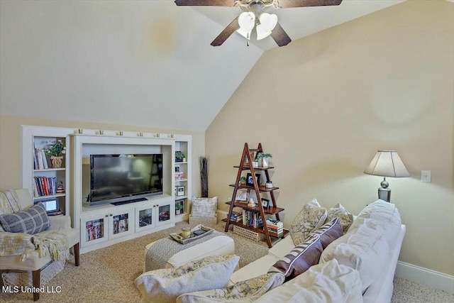 carpeted living room with ceiling fan, vaulted ceiling, and built in features