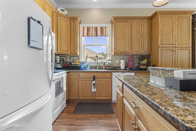 5200 W Beach Blvd, Gulfport, MS 39501 - kitchen featuring white appliances, wood finished floors, dark stone counters, crown molding, and brown cabinets