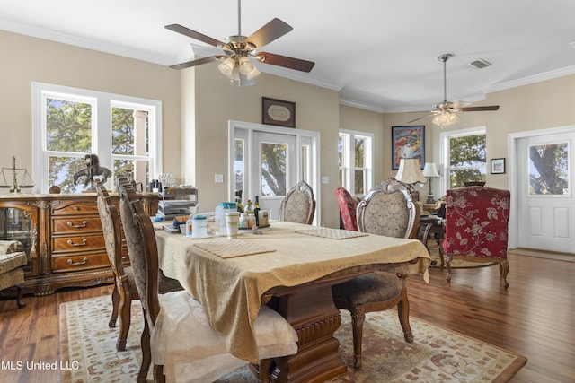 5200 W Beach Blvd, Gulfport, MS 39501 - dining room featuring ceiling fan, wood finished floors, and crown molding