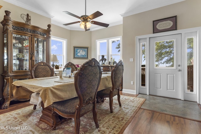 5200 W Beach Blvd, Gulfport, MS 39501 - dining space featuring wood finished floors, healthy amount of natural light, ornamental molding, and ceiling fan