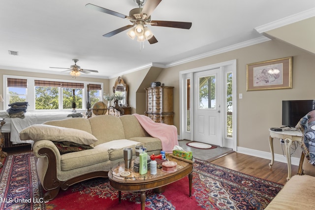 5200 W Beach Blvd, Gulfport, MS 39501 - living area featuring plenty of natural light, a ceiling fan, ornamental molding, and wood finished floors