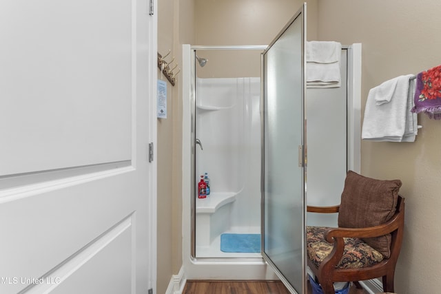 5200 W Beach Blvd, Gulfport, MS 39501 - full bathroom with a shower stall and wood finished floors