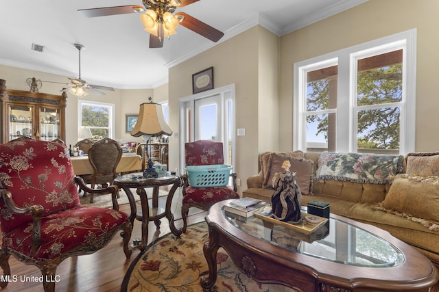 5200 W Beach Blvd, Gulfport, MS 39501 - living room with wood finished floors, ceiling fan, and crown molding