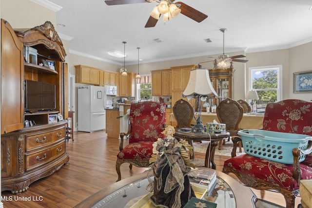 5200 W Beach Blvd, Gulfport, MS 39501 - living area with ceiling fan, light wood-style floors, and crown molding