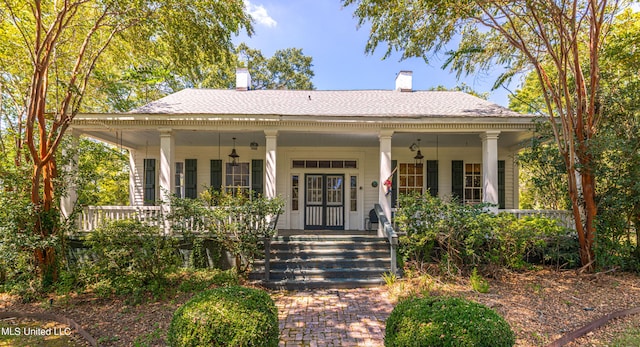 3775 Coker Rd, Madison, MS 39110 - view of front facade featuring a porch, a chimney, and roof with shingles