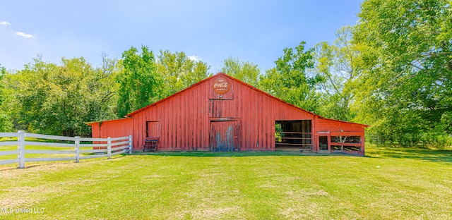 view of outdoor structure featuring a lawn