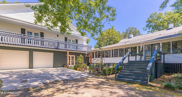 3775 Coker Rd, Madison, MS 39110 - view of front of house with french doors, concrete driveway, an attached garage, a deck, and stairway
