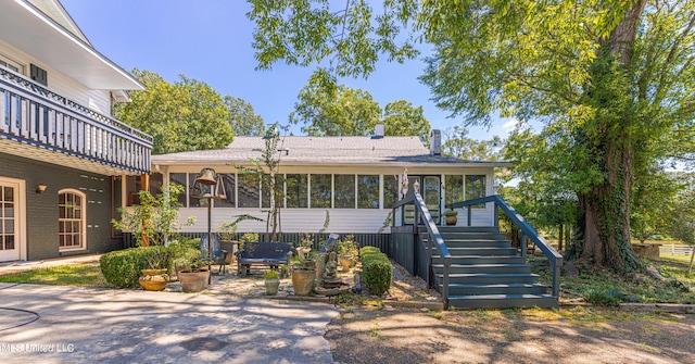 3775 Coker Rd, Madison, MS 39110 - back of property featuring stairway, a sunroom, roof with shingles, and a patio