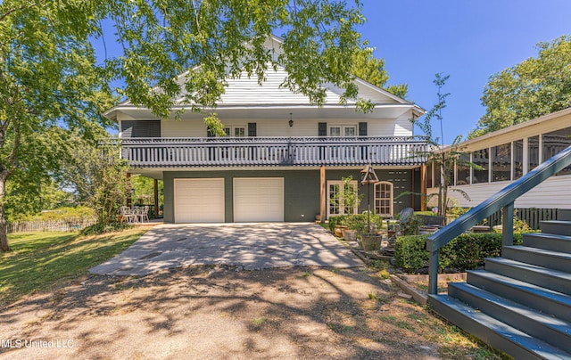 3775 Coker Rd, Madison, MS 39110 - view of front of property with stairs, driveway, a garage, and a wooden deck