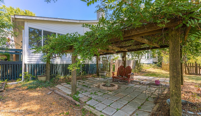 view of patio / terrace featuring a fire pit