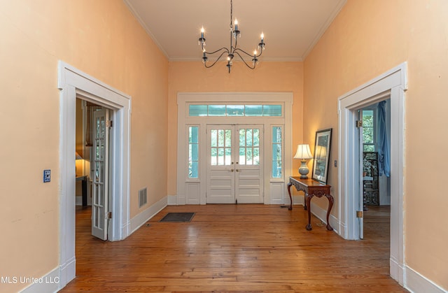 3775 Coker Rd, Madison, MS 39110 - entrance foyer featuring ornamental molding, a chandelier, hardwood / wood-style flooring, baseboards, and a towering ceiling