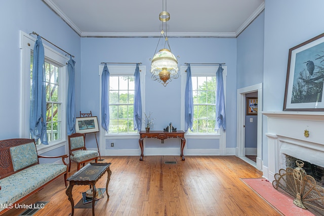 3775 Coker Rd, Madison, MS 39110 - living area with a chandelier, hardwood / wood-style flooring, ornamental molding, a fireplace with flush hearth, and baseboards