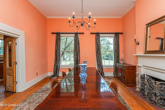 3775 Coker Rd, Madison, MS 39110 - dining space featuring a chandelier, wood finished floors, crown molding, healthy amount of natural light, and baseboards