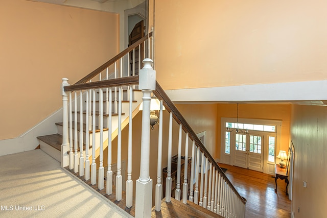 3775 Coker Rd, Madison, MS 39110 - stairs with wood finished floors and a chandelier