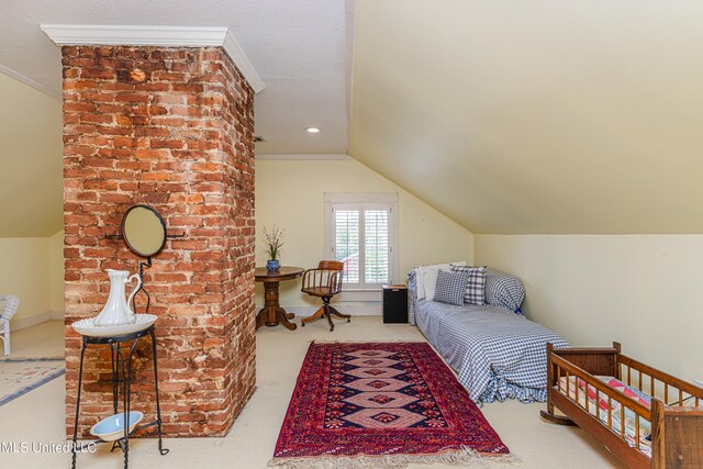 carpeted bedroom featuring vaulted ceiling