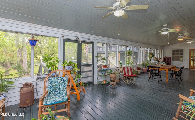 sunroom / solarium with lofted ceiling and ceiling fan