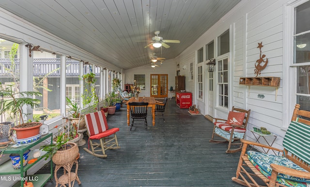 sunroom / solarium with ceiling fan, wooden ceiling, and lofted ceiling